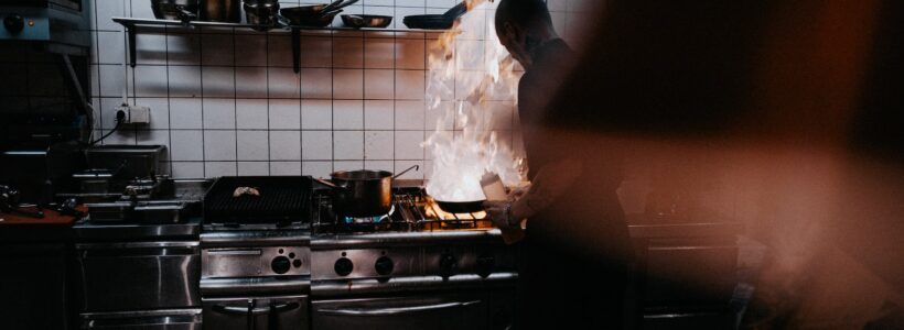 person doing cook inside kitchen
